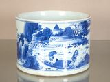 a blue and white cup sitting on top of a table
