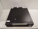 a black dvd player sitting on top of a white box