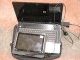 a laptop computer sitting on top of a bag