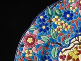 a colorful plate with flowers and leaves on it