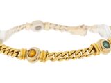 a close up of a bracelet on a white background