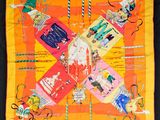 yellow and orange scarf with a picture of people on it