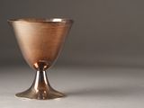 a silver cup that is sitting on a table