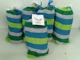 several rolls of towels are lined up on a shelf