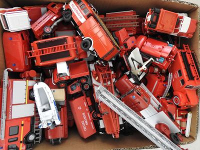 a box full of toy firetrucks and trucks in it