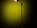 a lamp that is sitting on top of a table in the dark