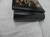 a small black box with a picture of birds and flowers on it