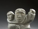 statue of a man holding a child in his arms
