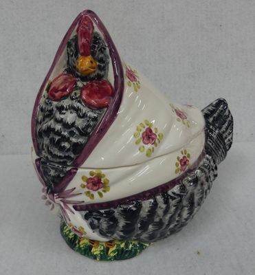 a chicken that is sitting on a white table