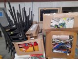 many boxes and chairs stacked on top of each other