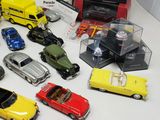 a lot of toy cars that are on a table