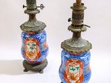 two small vases that are sitting on a table