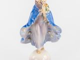 an image of a figurine of a woman holding a baby