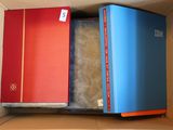 two books in a box one is red and the other is blue