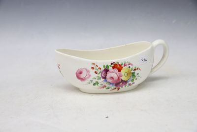 a close up of a white bowl with flowers on it