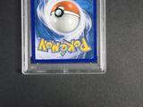 a close up of a pokemon trading card in a plastic holder