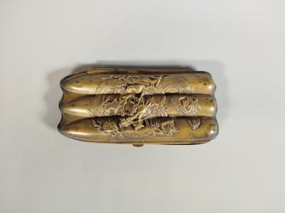 a close up of a metal object on a white surface