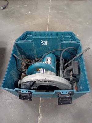 a blue tool box with a circular saw in it