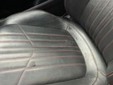 a close up of a car ' s leather seat with stitching on it