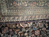 a rug that has many different colors and patterns on it