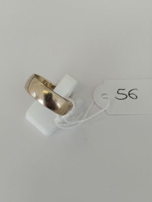 a close up of a ring on a white surface with a price tag