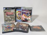 three video games on the table with a white background