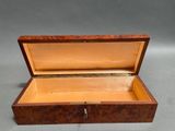 an image of a wooden box with a key in it