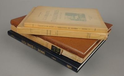 three books stacked on top of each other on a table