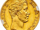 a close up of a gold coin on a white background
