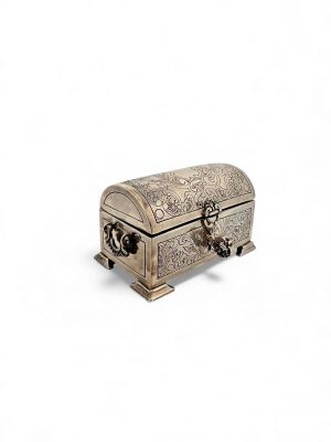 silver metal jewelry box with ornate design on a white background
