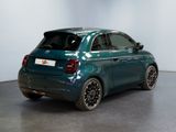 the rear end of a small blue car parked in a room