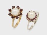 two rings with pearls and garnets on them