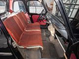 a red seat in the back of a black car