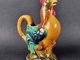 a ceramic rooster that is sitting on a table