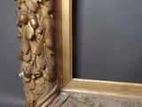 an image of a gold frame with a decorative design on it