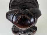 a small figurine of a man with a hat on
