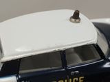 a toy police car that is sitting on top of a table