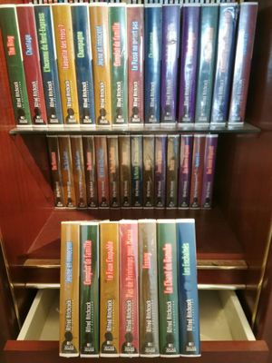 a lot of books on a shelf in a library