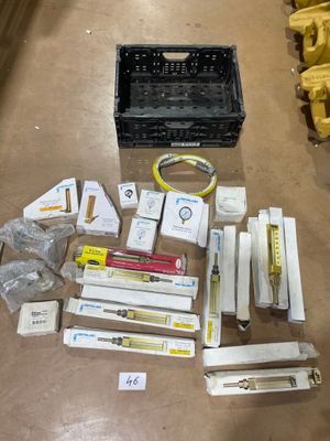 a box of assorted items sitting on the floor