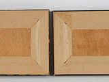 two pieces of wood are sitting on top of each other