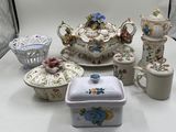 many different types of porcelain items on the table
