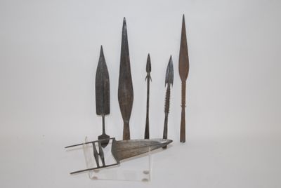 four different types of knives on display on a white surface