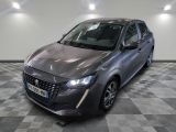la photo d'une voiture grise garée dans une salle d'exposition