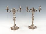 pair of silver plated candelabs with candlesticks on stands