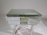 a glass table with a drawer on top of it