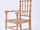 a wooden chair with a woven seat on a white background