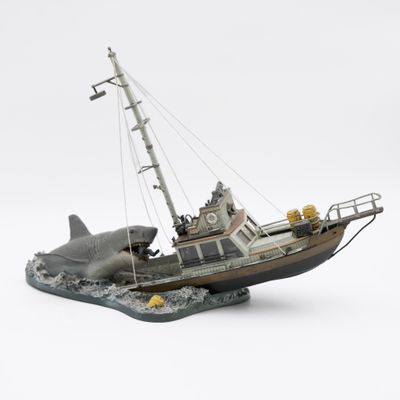 a model of a boat with a shark on it