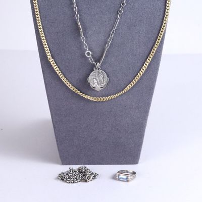 necklace and earring set on display in a display case