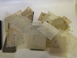 many pieces of paper that are sitting on a table