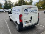 a white van that is parked in a parking lot